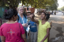 Distributing photos in slum